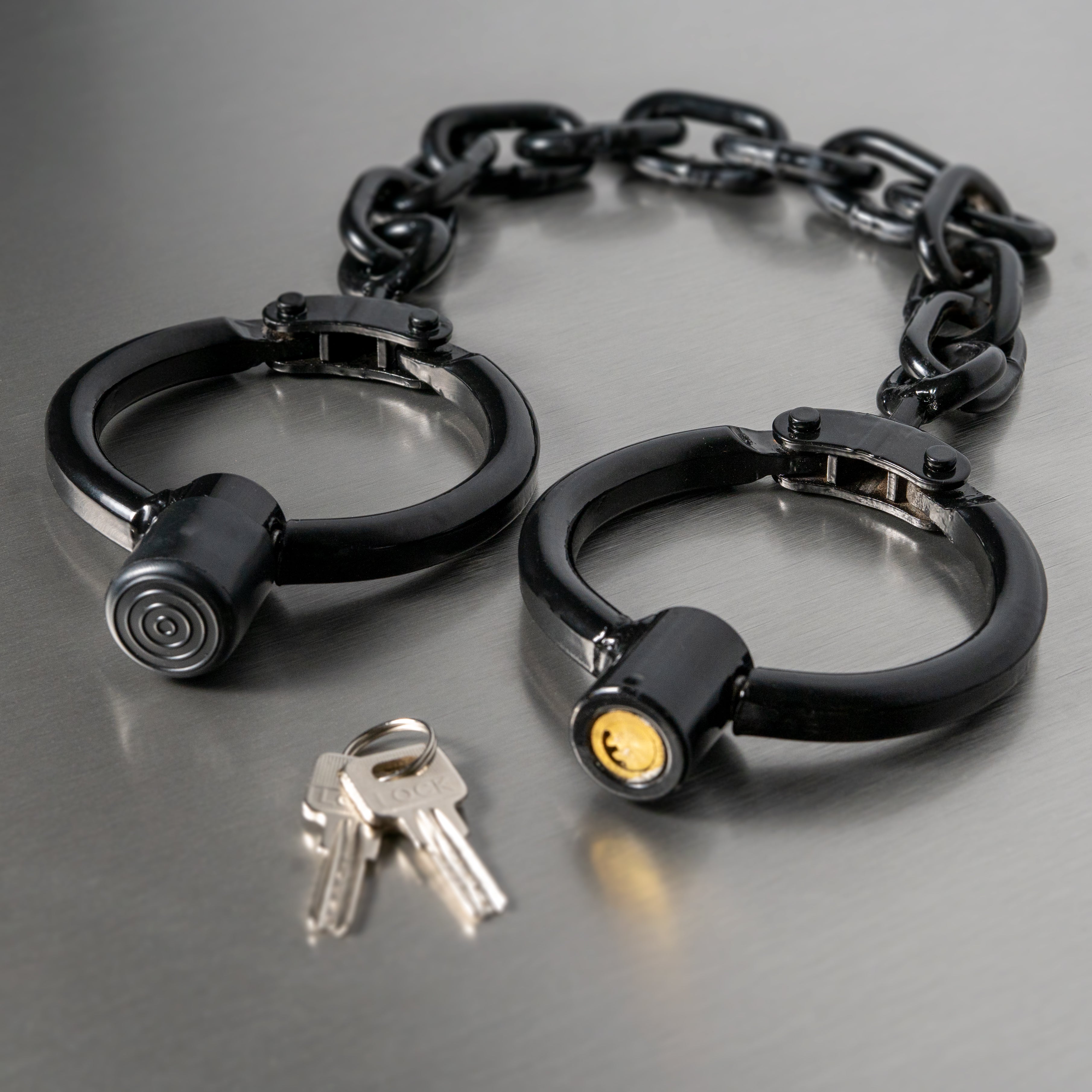 Very heavy leg irons with large chain in black