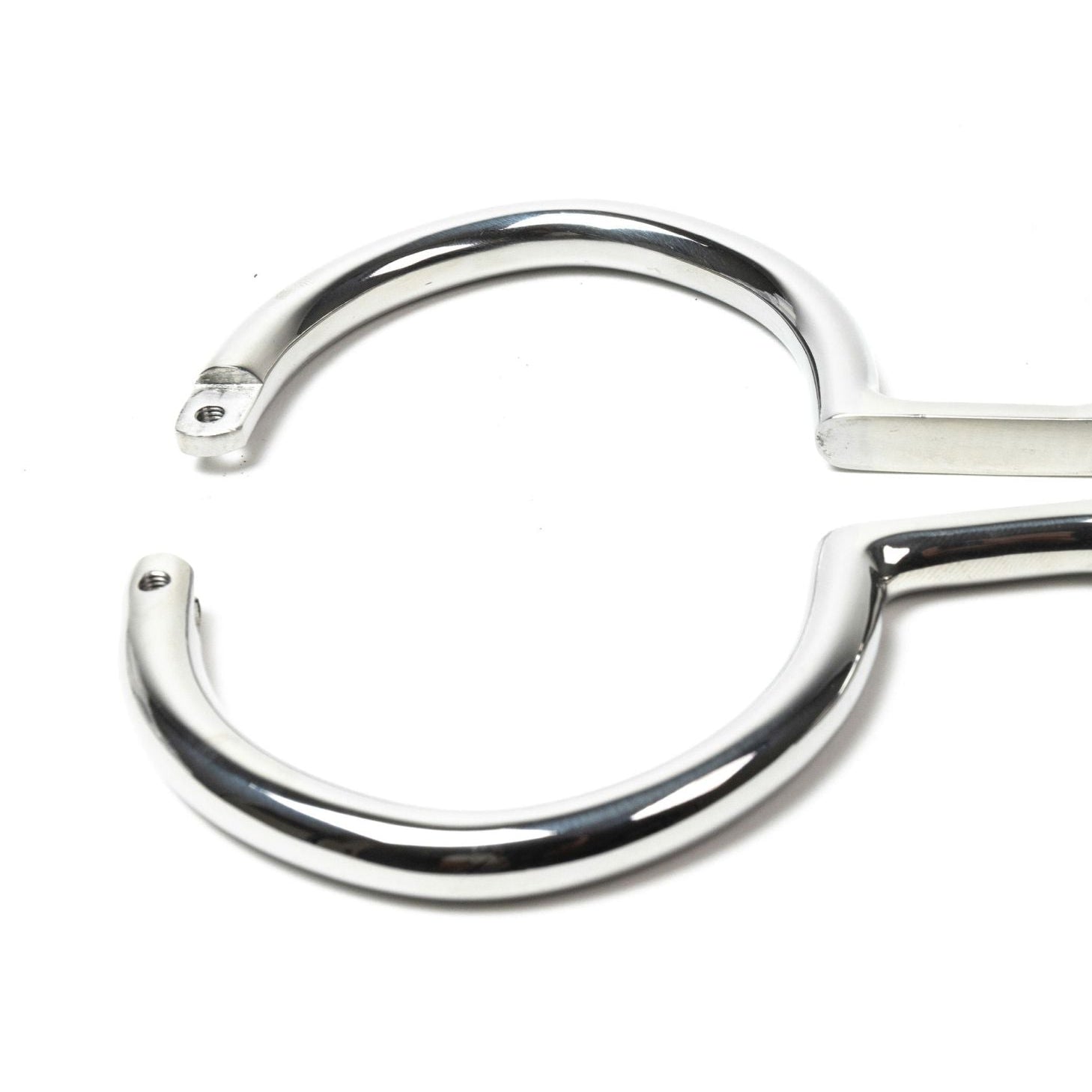 Rigid polished steel leg irons